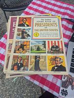 Cover of Golden Stamp Book of Presidents with other books beneath