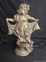 Full view of resin figurine on pedestal