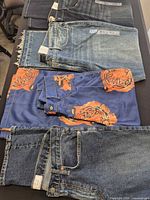 Stack of jeans showing GAP pair with other garments