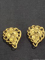 Front view of both brooches showing leaf design
