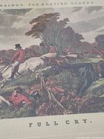 Close-up of central horse and riders showing print detail and caption