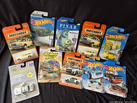 All nine blister-packed cars laid out