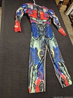 Full view of children’s robot jumpsuit laid flat