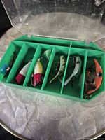 overall view of green tackle box and lures