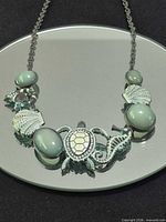 Full necklace showing chain and sea life design
