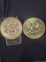 Both brass plaques front view