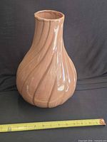 Full view of Red Wing terracotta glazed vase beside ruler showing height