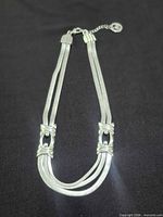 Full view of silver-tone multi-strand necklace with extender