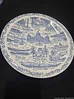Full view of blue and white Iowa landmarks plate