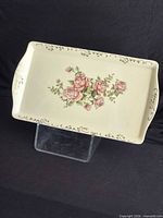 Full view of rectangular tray showing floral design and handles