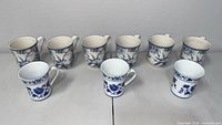 All nine mugs front view showing designs and quantities