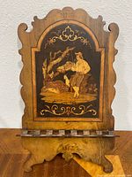 Full view of wooden marquetry music stand front