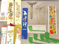 Overview of entire lot showing metal and paper bookmarks and St. Patrick Pipes card