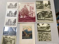 Overview of entire lot showing photo, print and seven postcards