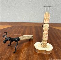 Both items: bottle opener and carved bone totem pole bud vase