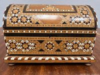 Front view of marquetry jewelry box closed