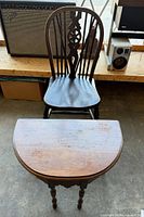 Chair and demi-lune table front view