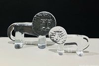 Front view of both clear glass lions