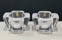 Front view of both crystal candle holders with Orrefors labels visible