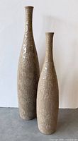 Both ceramic vases standing side by side