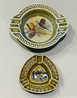 Front view of both Wade ashtrays showing motifs and shape
