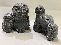 Both soapstone owl figurines side by side