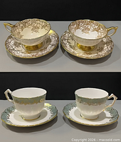 Full view of four cup-and-saucer duos, two patterns