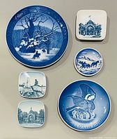 Front view of all six blue-and-white porcelain plates and plaques