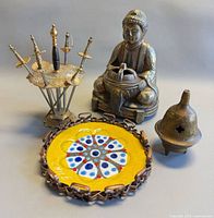 Group shot of Buddha burner, bell censer, cocktail sword set, Chile dish