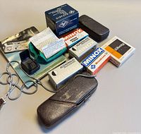 All items laid out including camera, cases, film boxes and guide