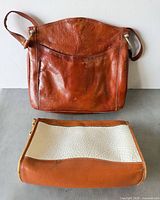 Front view of both bags showing overall style and size comparison