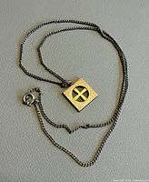 Necklace laid out to show chain and pendant front