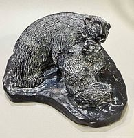 Front view of soapstone bear and cub sculpture
