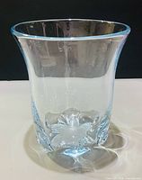 Front view of clear crystal vase with flared rim