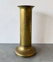 Front view of brass cylinder vase