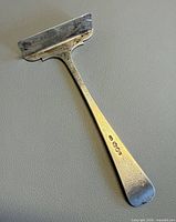 Front view of sterling silver toddler food pusher