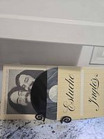 Record partially pulled from sleeve inside gatefold