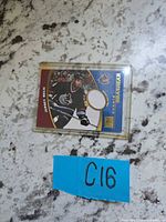 Front view of Donald Brashear jersey relic card in plastic sleeve
