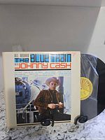 Front album cover with record partially visible