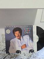 Front jacket with record partially visible