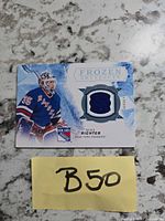 Front of Mike Richter Frozen Artifacts jersey card showing player image, jersey swatch, card title, team logo