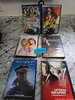All six DVD movie cases arranged for identification