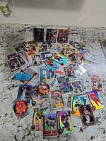 Overview of all trading cards spread on countertop