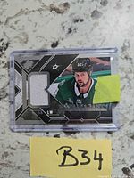 Front view of Jamie Benn SPx jersey card in case with jersey swatch visible