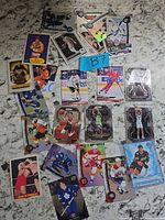 Overview of entire lot showing mix of NHL, NBA and WWF/WWE cards