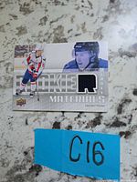 Front of Cody Eakin Rookie Materials card with jersey swatch and lot marker C16