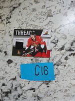 Front of Pinnacle Threads Jason Spezza jersey card showing player image and jersey swatch