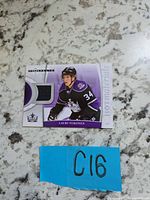 Front of Fleer Hot Prospects Hot Materials card showing Lauri Tukonen image, black jersey swatch, card branding