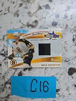 Front of Bowman YoungStars Fabric of the Future jersey card showing player image and black swatch