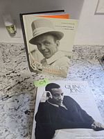 Two books displayed on countertop: The Sinatra Treasures standing, The Complete Quincy Jones lying flat